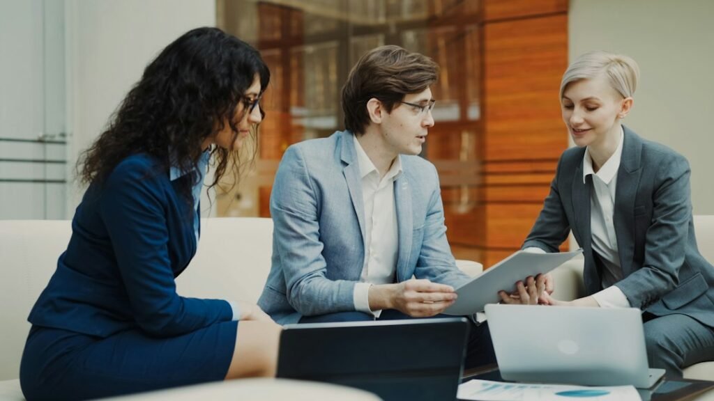 Business partners discussing a contract in a modern meeting room