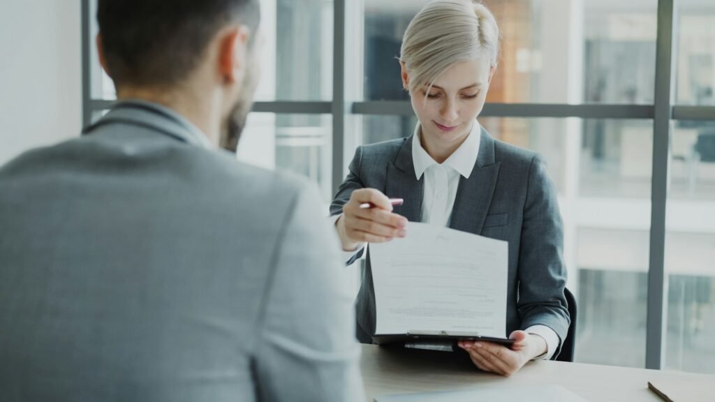 HR and business administration professional reviewing a CV in an office