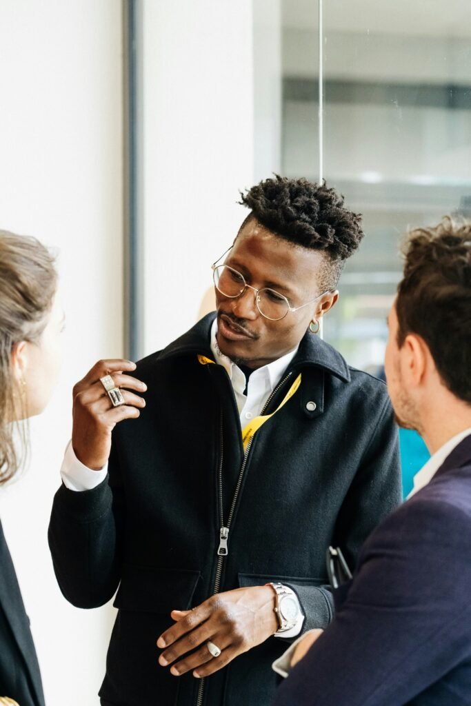 Business professionals having a conversation in a modern workplace