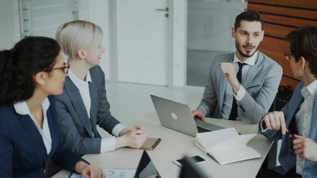 Business professionals collaborating around a table in a modern office