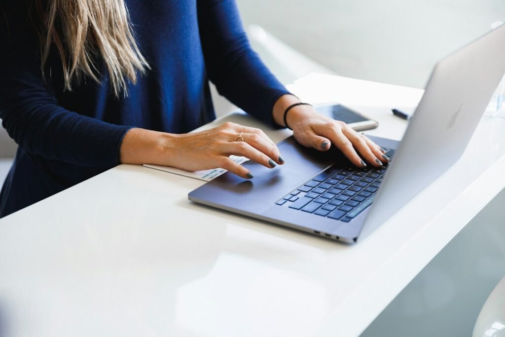 Professional working on a laptop in an office