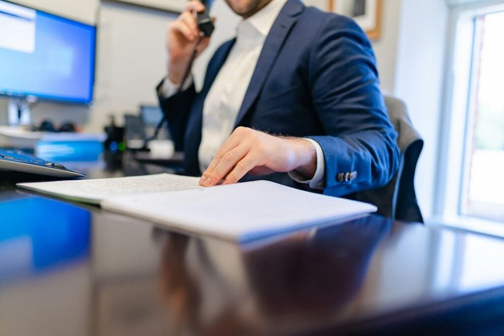 Professional working carefully with documents at a desk